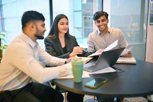 Collaborators working together at a desk